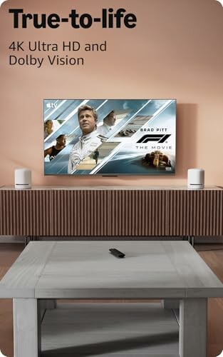 TV on stand displaying a movie poster with text 'True-to-life 4K Ultra HD and Dolby Vision'.
